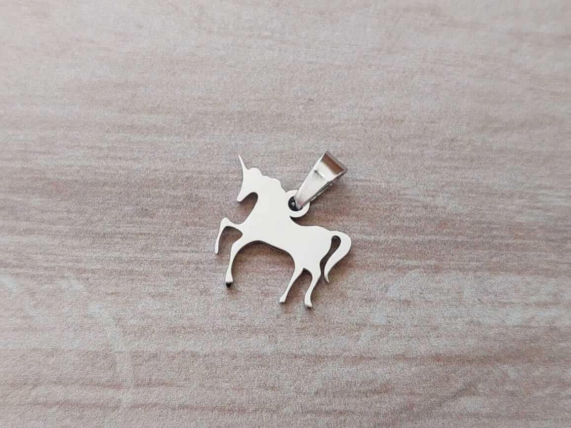 DIJE DE ACERO UNICORNIO 17 X 16 MM