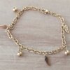 PULSERA DE ACERO DORADO ESLABÓN TIFFANY CON ALAS Y BOLITAS COLGANTES. LARGO 18,5 CM