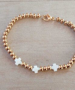 PULSERA DE ACERO DORADO BOLITAS 3 MM CON TRES CRUCES DEL EQUILIBRIO DE NÁCAR EN EL CENTRO. LARGO 18 CM.