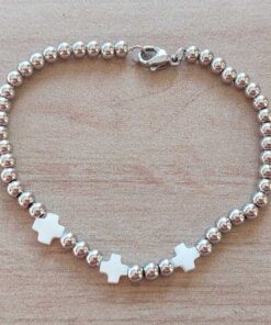 PULSERA DE ACERO DE BOLITAS 3 MM CON TRES CRUCES DEL EQUILIBRIO DE NÁCAR EN EL CENTRO. LARGO 18 CM.