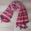 PASHMINA LINEA PREMIUM TRAMADA CON BORLAS, BASE BORDO CON FLORES Y GUARDAS FINALES. 90 X 190 CM.