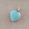 DIJE DE ACERO PIEDRA AQUA EN FORMA DE CORAZÓN. 20 MM