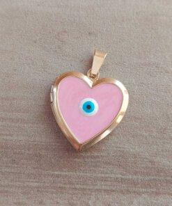 DIJE DE ACERO DORADO RELICARIO CORAZÓN ESMALTADO COLOR ROSA CON OJITO TURCO EN EL CENTRO. TAMAÑO 22 MM