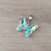 DIJE DE ACERO MARIPOSA DE ACRÍLICO TORNASOL. 15 X 20 MM
