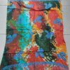 PAREO HINDU BATIK CON FLECOS MULTICOLOR CON ESTAMPA CARACOL. TAMAÑO 100 X 180 CM.