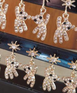 BLISTER DE AROS PASANTE DE ACERO DORADO ESTRELLA STRASS CON OSO COLGANTE CON STRASS X 12 PARES.