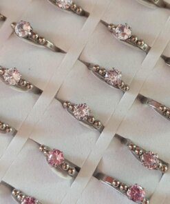 ANILLOS DE ACERO X 36 UNIDADES CON STRASS Y BOLITAS SURTIDOS EN MEDIDAS Y EN COLOR (BLANCO/ROSA). (MEDIDAS DEL 16 AL 20)