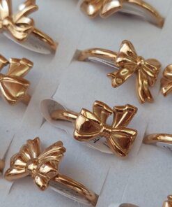 ANILLOS DE ACERO DORADO FIGURA MOÑO X 36 UNIDADES SURTIDOS EN MEDIDAS. (MEDIDAS DEL 16 AL 19)