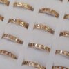 ANILLOS FIGURA CALADA DE ACERO DORADO (GUARDA GRIEGA / ESLABÓN) X 36 UNIDADES SURTIDOS EN MEDIDAS. MEDIDA DEL 17 AL 20.
