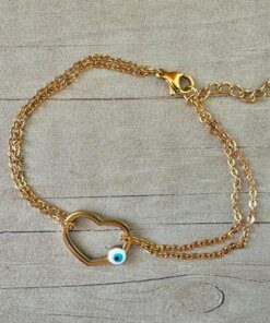 PULSERA DE ACERO DORADO ESLABÓN ESPEJITO DOBLE CON CENTRO CORAZÓN CALADO CON OJO BLANCO. LARGO 17,5 + 3 CM EXT.