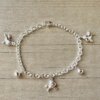 PULSERA DE ACERO BLANCO ESLABÓN TIFFANY CON UNICORNIOS Y BOLITAS. LARGO 18,5 CM