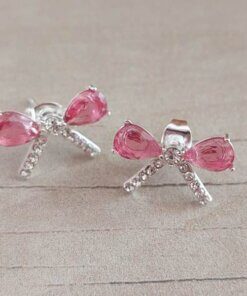 ARO DE ACERO BLANCO MOÑO CON STRASS Y CUBIK FUCSIA. MEDIDAS 18 X 11 MM