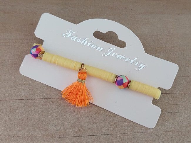 PULSERA ELASTIZADA FIMO DISCO AMARILLO CON POMPÓN NARANJA