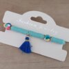 PULSERA ELASTIZADA FIMO DISCO CELESTE CON POMPÓN AZUL