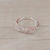 ANILLO DE ACERO BLANCO ALAS CON MICRO PAVE CRISTAL, TALLE UNICO.