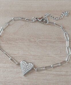 PULSERA DE ACERO ESLABÓN ALARGADO CON CORAZÓN CON STRASS EN EL CENTRO. LARGO 19,5 CM + 5 CM EXT.