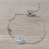 PULSERA DE ACERO ESPEJITO CON CENTRO CUBIK LAGRIMA CON STRASS ALREDEDOR Y SUSANITO. LARGO 15,5 CM + EST. DE 4 CM