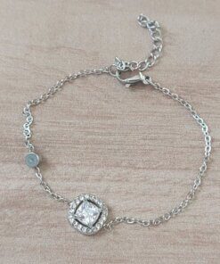 PULSERA DE ACERO ESPEJITO CON CENTRO STRASS CUADRADO CON STRASS ALREDEDOR Y SUSANITO. LARGO 15,5 CM + EST. DE 4 CM