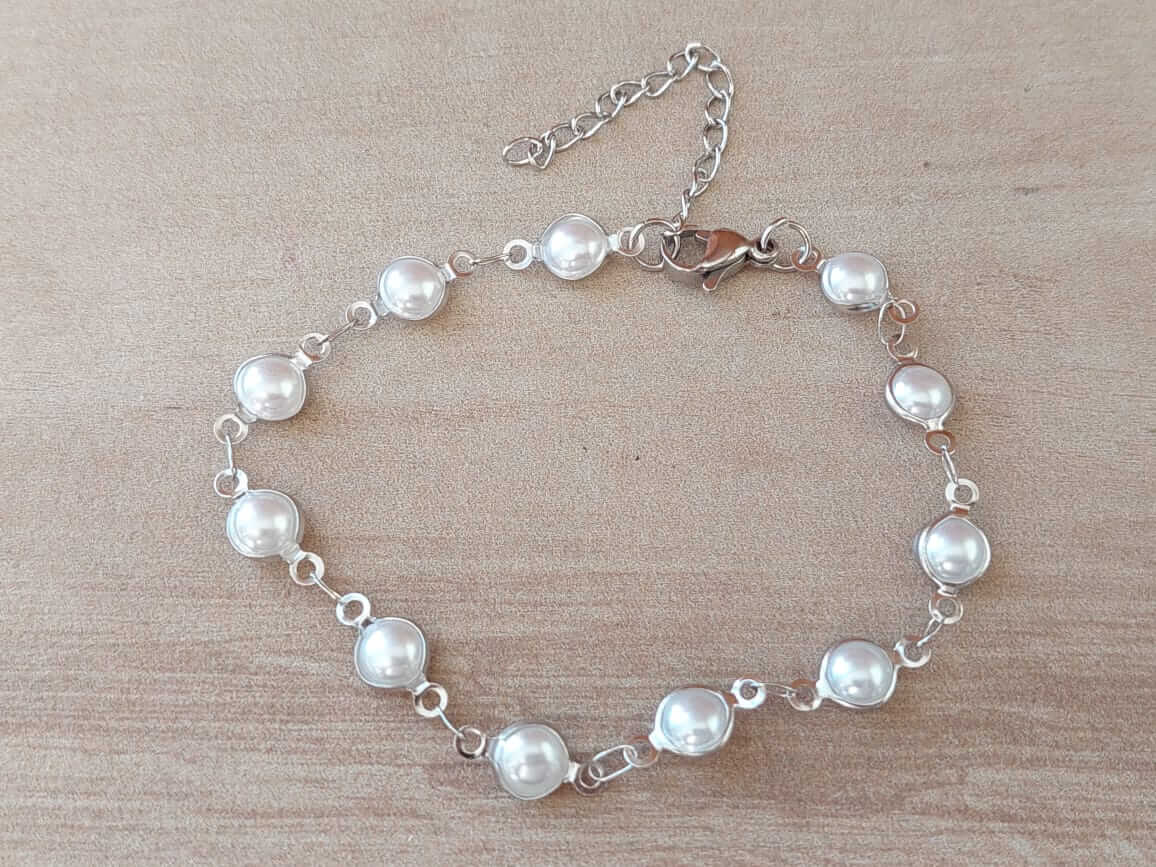 PULSERA DE ACERO PERLAS. LARGO 18 + 5 CM EXT.