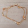 PULSERA DE ACERO DORADO DOBLE VENECIANA CON BOLITAS Y CORAZONES. LARGO 19 cm.