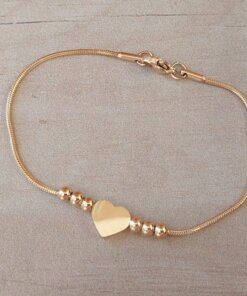 PULSERA DE ACERO DORADO ESLABÓN COLA DE RATÓN CON BOLITAS DE 3 MM Y CORAZÓN CENTRAL. LARGO 18,5 CM
