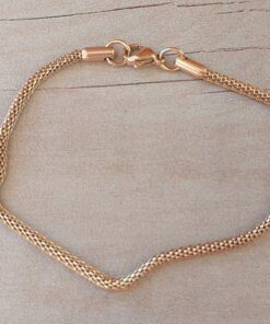 PULSERA DE ACERO DORADA MALLA TUBULAR. LARGO 19,5 CM.