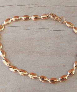 PULSERA DE ACERO ESLABÓN DORADO CONECTOR OVAL/SEMILLA. LARGO 18,5 CM