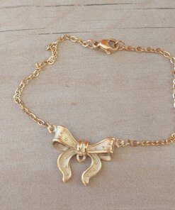 PULSERA DE ACERO DORADO ESLABÓN ESPEJITO CON CENTRO MOÑO. LARGO 18,5 CM