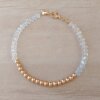 PULSERA DE TANZA CON MOSTACILLAS CRISTAL, BOLITAS 3 MM CENTRALES Y TERMINAL DE ACERO DORADO. LARGO 18 CM.