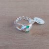ANILLO DE ACERO BLANCO VÍBORA ESLABÓN GRUMET OJOS STRASS VERDE