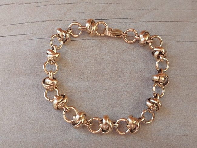PULSERA DE ACERO DORADO ESLABÓN ROLO CONECTADO CON ARGOLLA. LARGO 18,5 CM