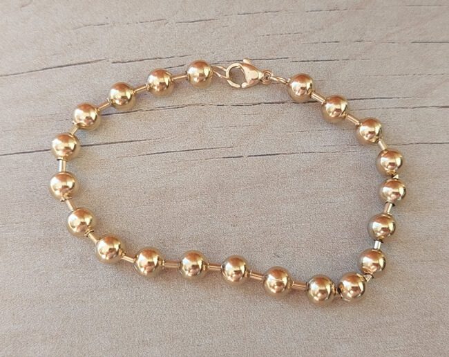 PULSERA DE ACERO DORADO ESLABÓN BOLITAS 5 MM. LARGO 19,5 CM