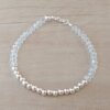 PULSERA DE TANZA CON MOSTACILLAS CRISTAL, CON CENTRO DE BOLITAS 3 MM Y TERMINAL DE ACERO BLANCO. LARGO 19 CM.