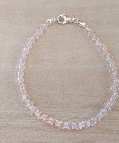 PULSERA DE TANZA CON MOSTACILLAS ROSA Y TERMINAL DE ACERO BLANCO. LARGO 18 CM.