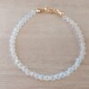 PULSERA DE TANZA CON MOSTACILLAS CRISTAL Y TERMINAL DE ACERO DORADO. LARGO 18 CM.