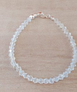 PULSERA DE TANZA CON MOSTACILLAS CRISTAL Y TERMINAL DE ACERO BLANCO CON 5CM DE EXTENSIÓN. LARGO 18 CM.