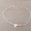 PULSERA DE ACERO BLANCO COLA DE RATÓN CON BOLITAS Y CORAZÓN PASANTE. LARGO 19 .