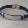 PULSERA DE CAUCHO TRENZADA CON CENTRO EN ACERO APTO PARA GRABAR. LARGO 20 CM.