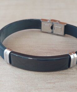 PULSERA DE CAUCHO CON CENTRO EN ACERO NEGRO APTO PARA GRABAR. LARGO 20 CM.