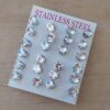 BLISTER DE AROS DE ACERO CUBIK BLANCO ENGARZADO 7 MM X 12 PARES.