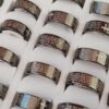 ANILLO DE ACERO NEGRO CON PADRE NUESTRO GRABADO X 36 UNIDADES. (MEDIDAS DEL 17 AL 22)