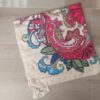 PAREO ESTAMPADO CON BORLAS 80 X 180 CM.