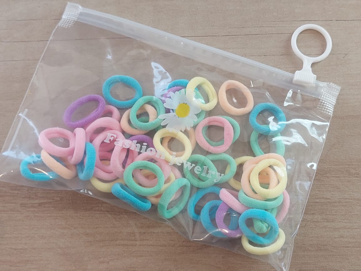 COLITAS MINI COLOR PASTEL. TAMAÑO 2.0. BOLSA X 50 UNIDADES APROX.