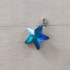 DIJE DE ACERO ESTRELLA 20 MM DE ACRÍLICO COLOR TURQUESA. 20 MM