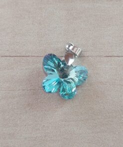 DIJE DE ACERO MARIPOSA DE ACRÍLICO CELESTE TORNASOL. 18 X 15 MM