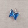 DIJE DE ACERO MARIPOSA DE ACRÍLICO CRISTAL AZUL. 15 X 20 MM