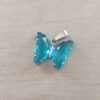 DIJE DE ACERO MARIPOSA DE ACRÍLICO CRISTAL TURQUESA. 15 X 20 MM
