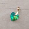 DIJE DE ACERO DORADO ACRÍLICO CORAZÓN VERDE . TAMAÑO 15 X 18 MM