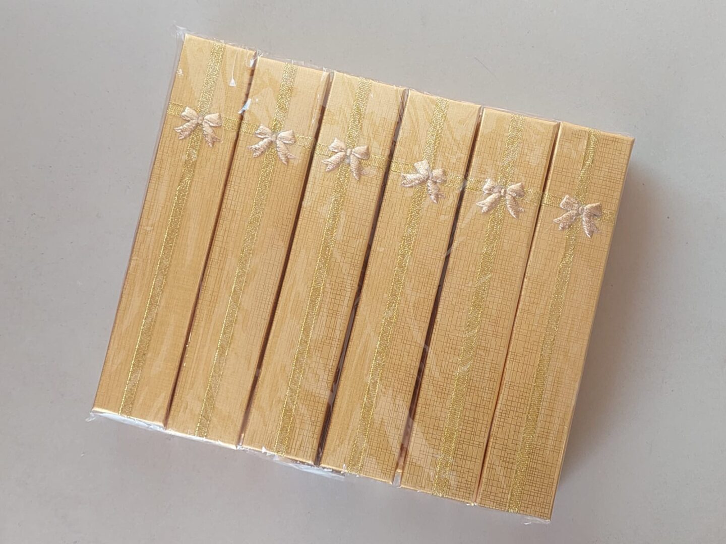 ESTUCHE PARA PULSERA DORADO X 12 UNIDADES. MEDIDAS 4 X 21 CM