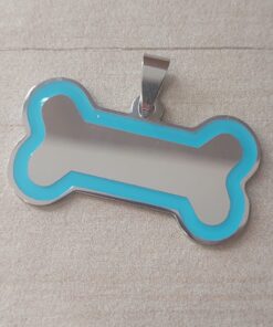 DIJE DE ACERO PARA GRABAR HUESO PULIDO AMBOS LADOS CON DETALLE CELESTE. ESPESOR 1 MM . MEDIDAS 18 X 35 MM
